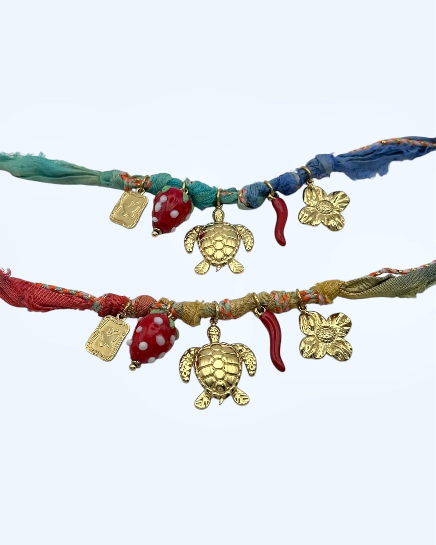 PULSEIRA BOHO COM TARTARUGA, FLOR E MORANGO EM AÇO