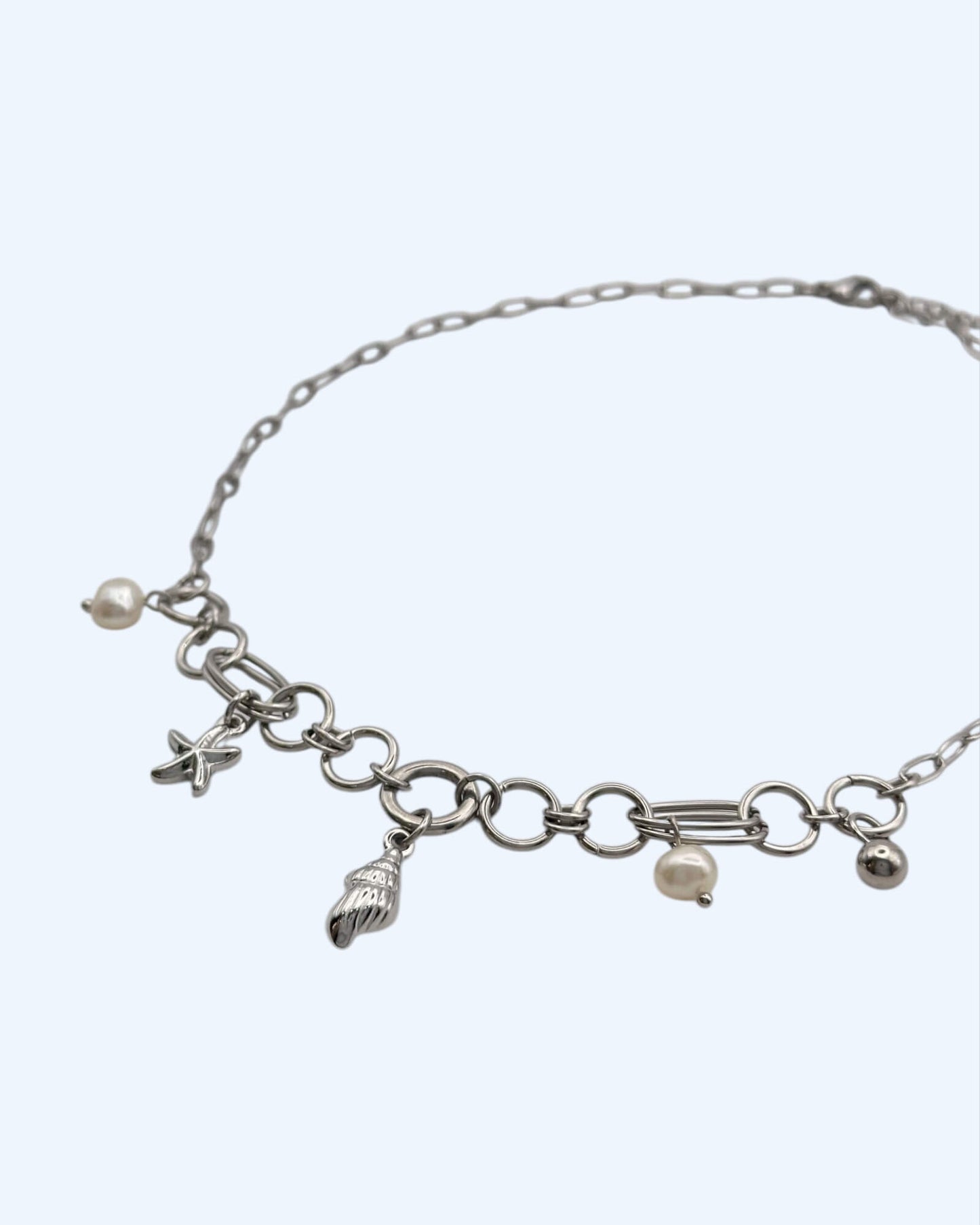 COLAR EM AÇO COM BÚZIO, PÉROLAS E ESTRELAS-DO-MAR