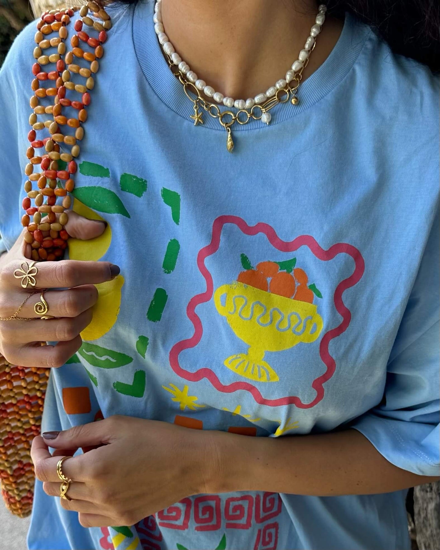 COLAR EM AÇO COM BÚZIO, PÉROLAS E ESTRELAS-DO-MAR