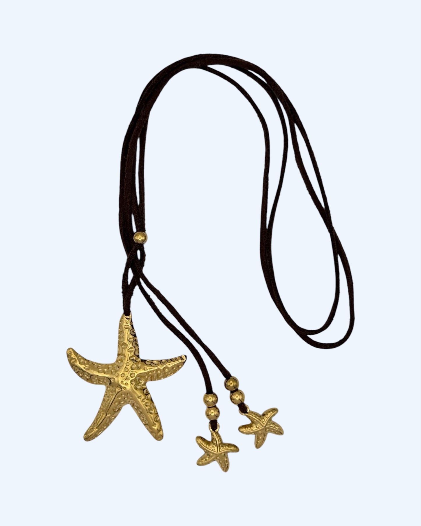 COLAR DE CAMURÇA COM ESTRELAS DO MAR em aço inoxidável
