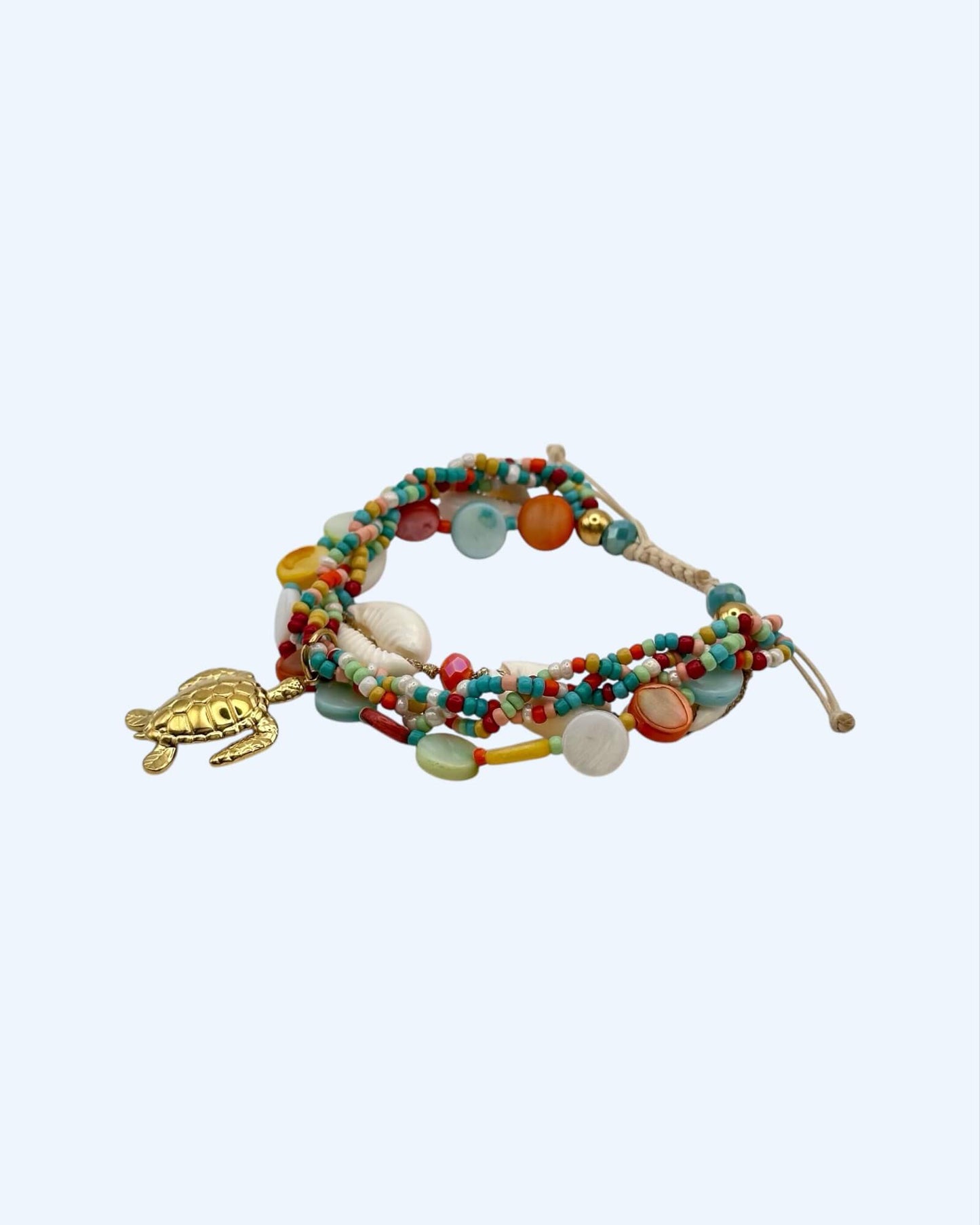 PULSEIRA VOLTAS COM BÚZIOS E TARTARUGA EM AÇO