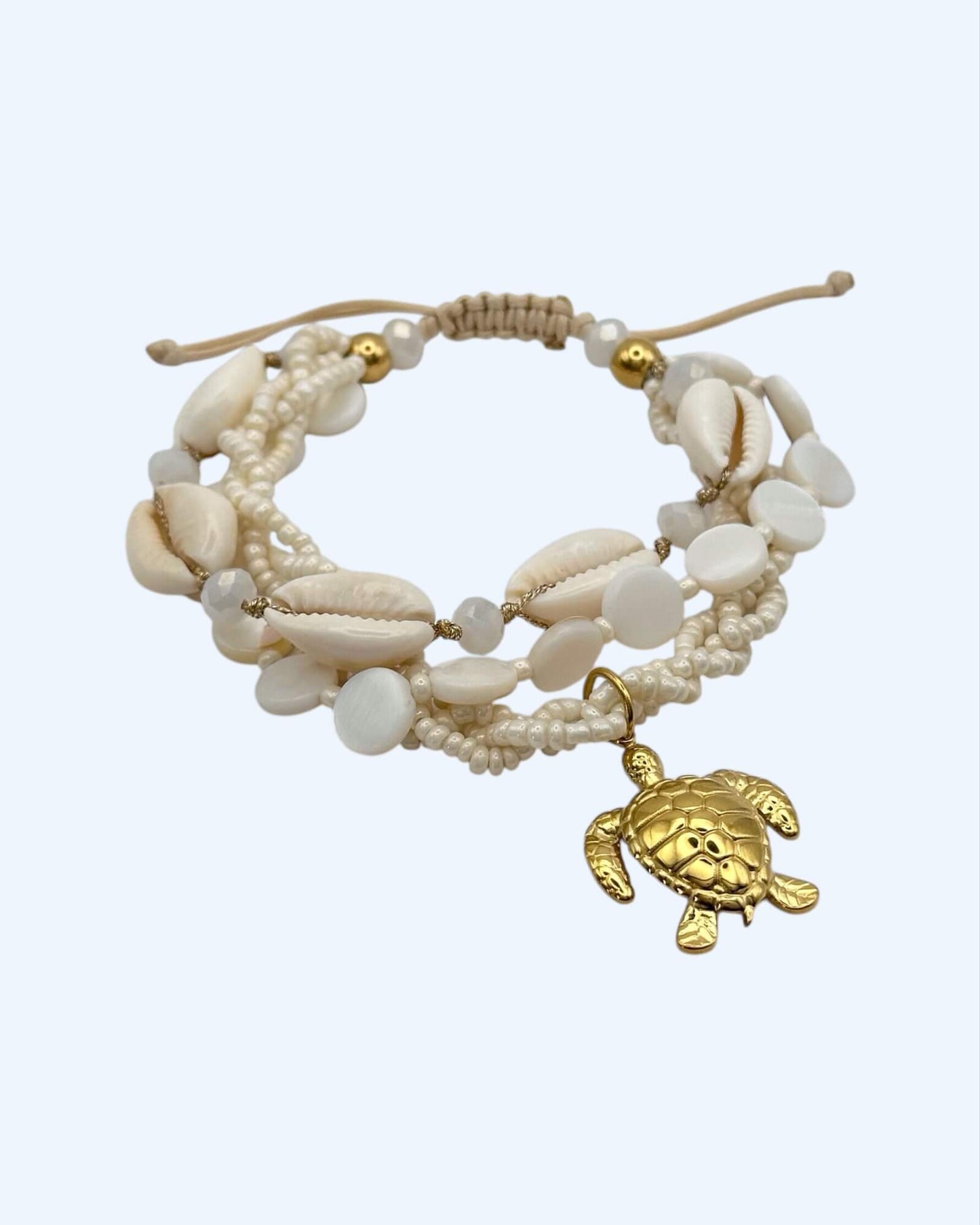 PULSEIRA VOLTAS COM BÚZIOS E TARTARUGA EM AÇO