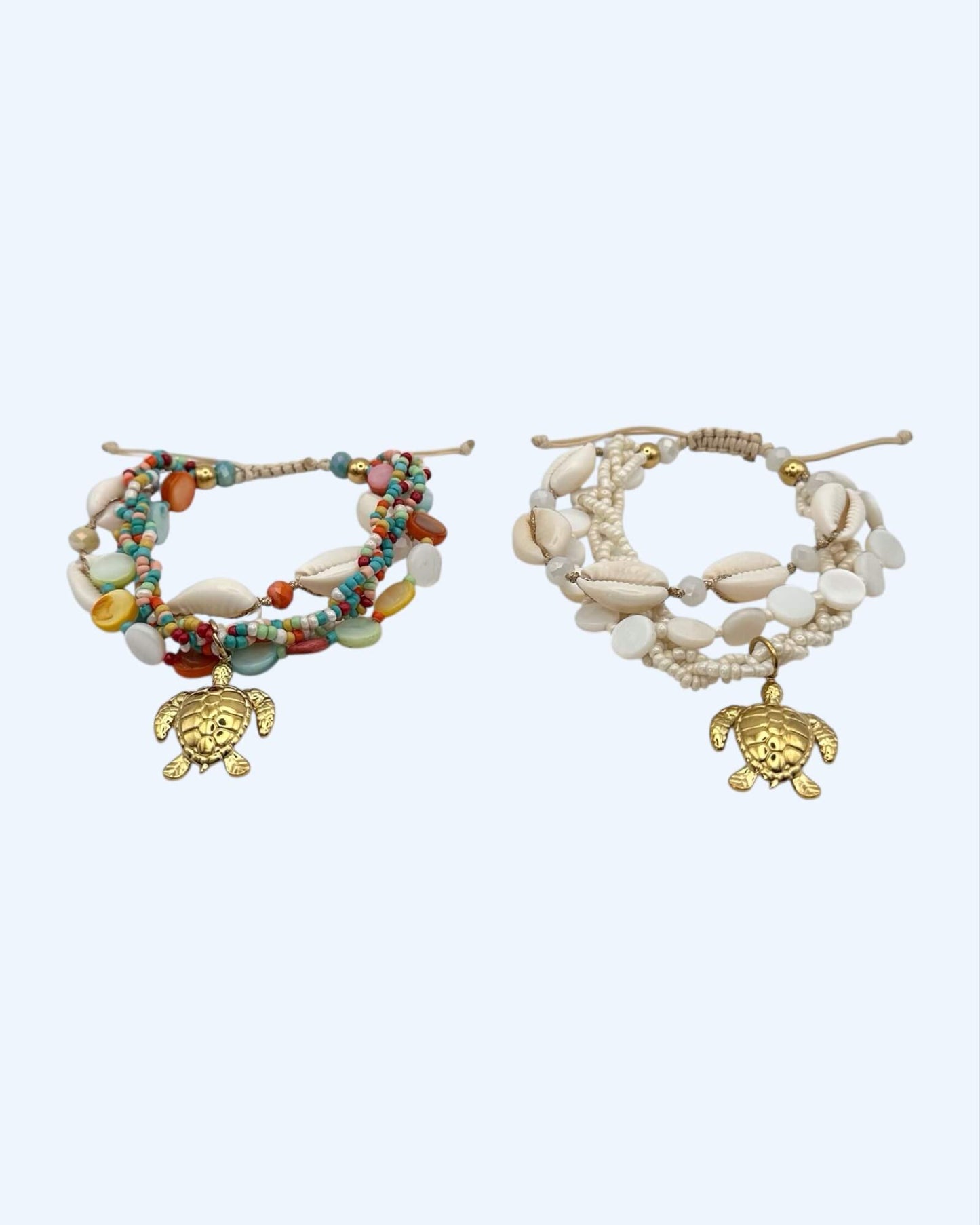 PULSEIRA VOLTAS COM BÚZIOS E TARTARUGA EM AÇO