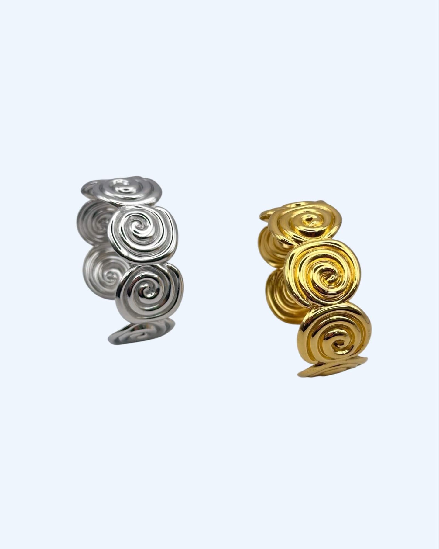 PULSEIRA RÍGIDA ESPIRAIS DOURADA OU PRATEADA EM AÇO