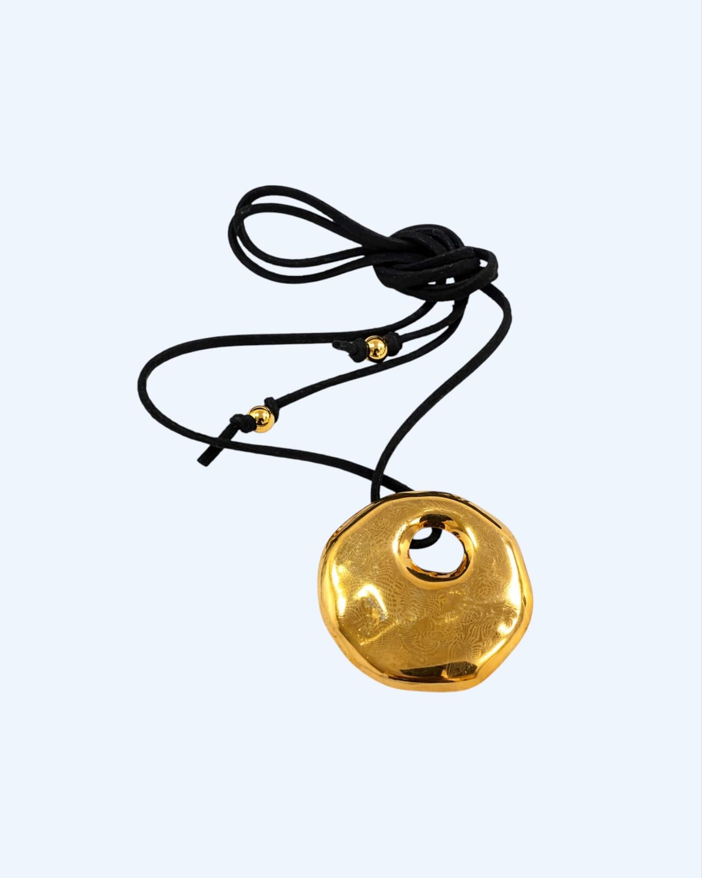 SUEDE NECKLACE WITH STAINLESS STEEL MEDALLION