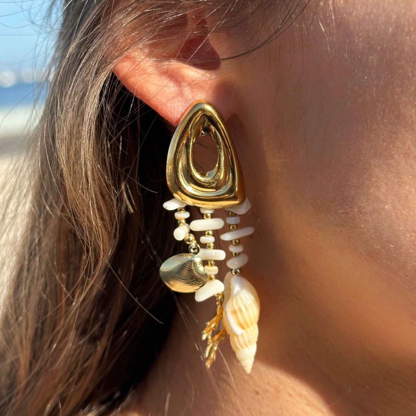 GOLD STEEL EARRINGS WITH COWRIES AND BEADS