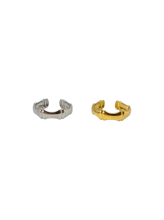 Vista frontal do Anel dourado ajustável em forma de tira com formas em aço inoxidável e do do Anel prateado ajustável em forma de tira com formas em aço inoxidável.