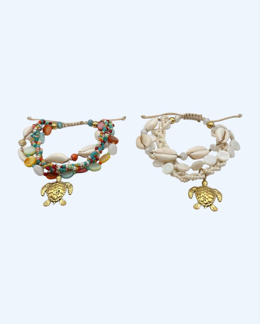 PULSEIRA VOLTAS COM BÚZIOS E TARTARUGA EM AÇO