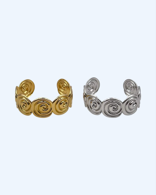 PULSEIRA RÍGIDA ESPIRAIS DOURADA OU PRATEADA EM AÇO