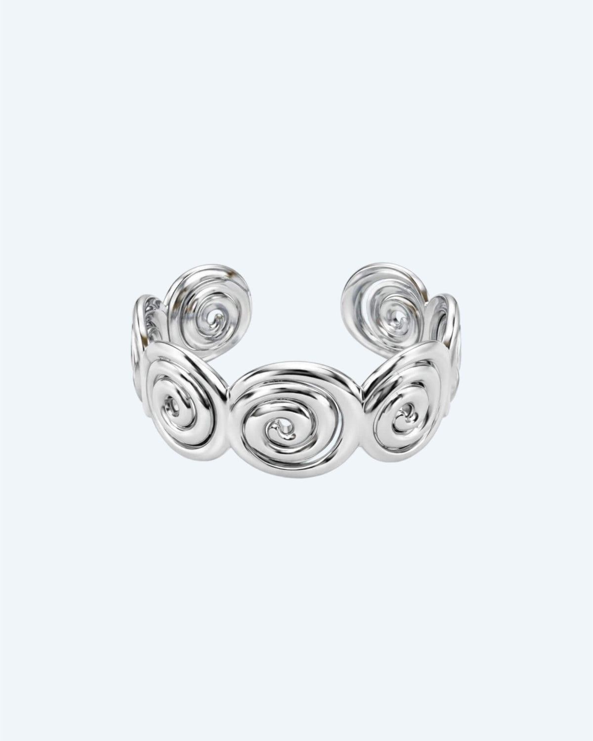 Vista frontal da Pulseira prateada rígida mas ajustável em aço inoxidável, composta por espirais recortadas e acabamento polido. Esta pulseira é ideal para looks boho ou urbanos, também para mais artisticos e de quem pretende ser simples com um detalhe ou para quem pretende juntar a um estilo bold.